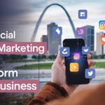 A person holding a smartphone with social media icons on screen with the St. Louis Gateway Arch in the background under a twilight sky; text overlay reads ‘Paid Social Media Marketing St Louis: Transform Your Business’.